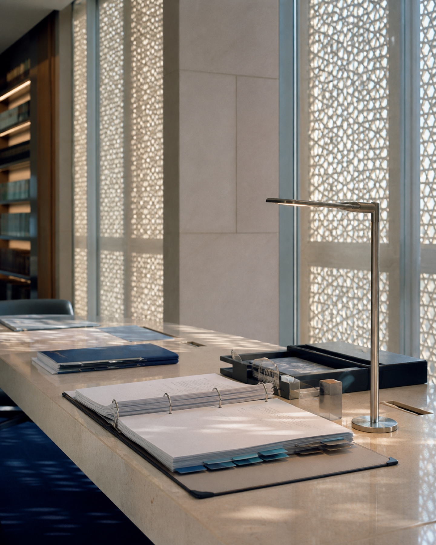 Compliance library with policy binders in patterned morning light